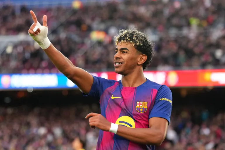 BARCELONA, SPAIN - FEBRUARY 28: Lamine Yamal of FC Barcelona celebrates scoring his team's third goal and completing his hat-trick during the LaLiga EA Sports match between FC Barcelona and Villarreal CF at Spotify Camp Nou on February 28, 2026 in Barcelona, Spain. (Photo by Alex Caparros/Getty Images)