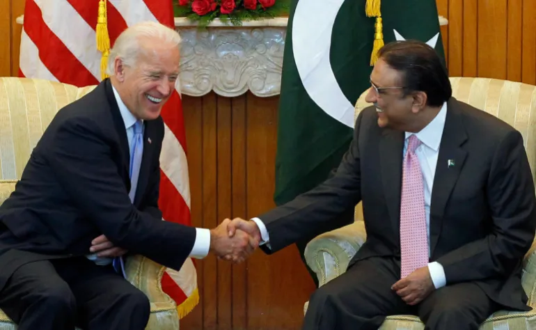 U.S. Vice President Joe Biden (L) shares a laugh while sitting down to meet with Pakistan's President Asif Ali Zardari at the President House in Islamabad January 12, 2011. Biden will pressure Pakistan to intensify its crackdown on militants in talks on Wednesday with Pakistan's leadership, but will tread carefully to avoid further straining ties. REUTERS/Adrees Latif (PAKISTAN - Tags: POLITICS)