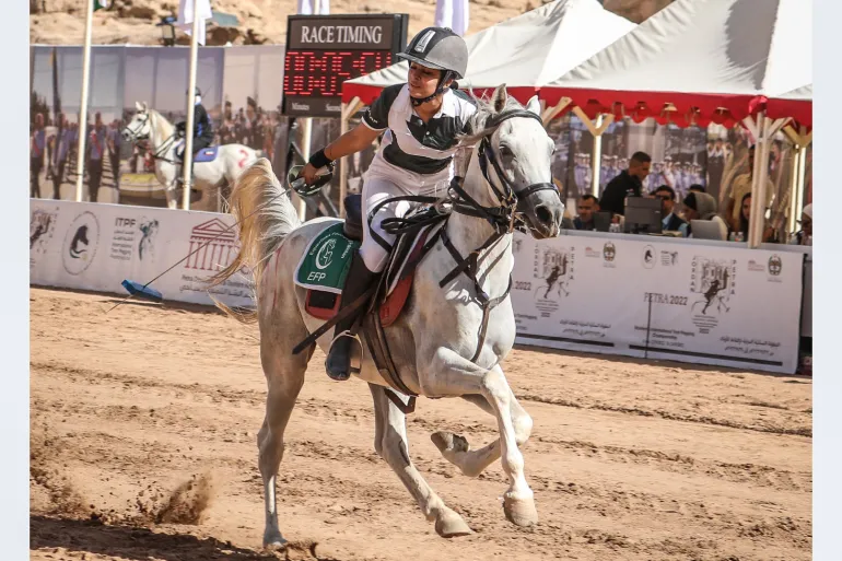 Ayesha Khan successfully picking up the first peg of the event under harsh weather conditions at the 2022 Jordan Grand Prix Tent Pegging Championship competing among 14 nations