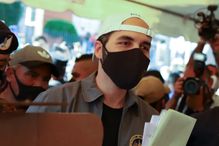 Nayib Bukele votes in San Salvador in 2021, amid strict pandemic controls introduced by his government.