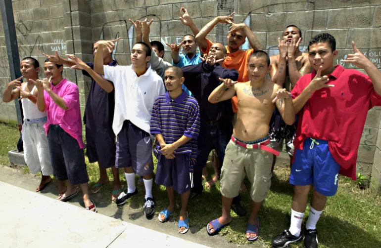 Young members of the MS-13 pose inside a juvenile detention centre near San Salvador in 2005, during a period when gangs exerted widespread control over communities.