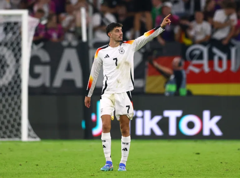 Kai Havertz raises his arm in celebration