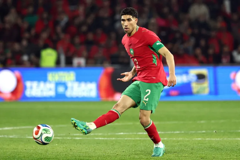 Achraf Hakimi kicking the ball