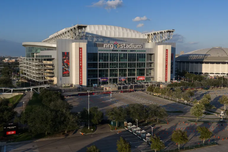 An aerial view of the NRG Stadium, one of the stadiums that will host 2026 FIFA World Cup matches, in Houston, Dec. 28, 2025. The Astrodome is pictured on right. (AP Photo/Jon Shapley)